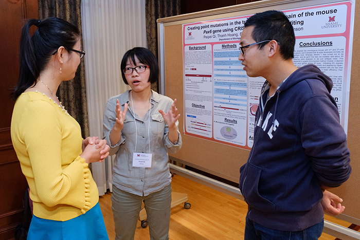 grad students presenting research