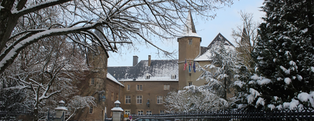 snowy view of chateau and gates
