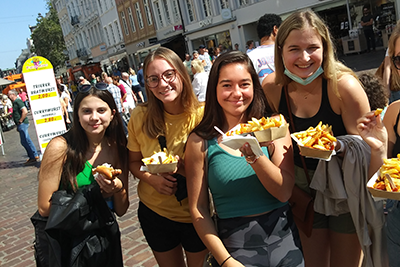 Students in Trier hold up pommes frites