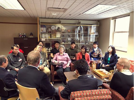 Chinese Embassy officials drink tea and chat at the Confucius Institute at Miami University (CIMU)