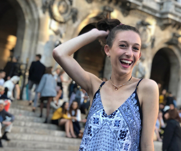 Miami student posing in front of a European building