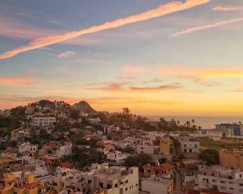  beautiful sunset over a town in Mexico
