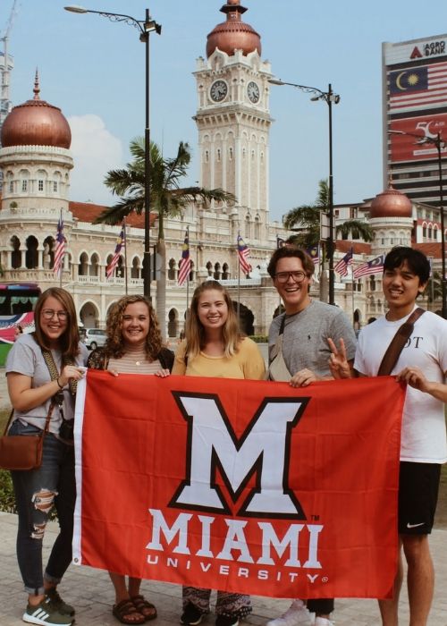 Students hold Miami flag