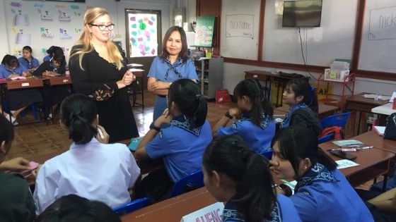 a Miami student teaches a class of children abroad