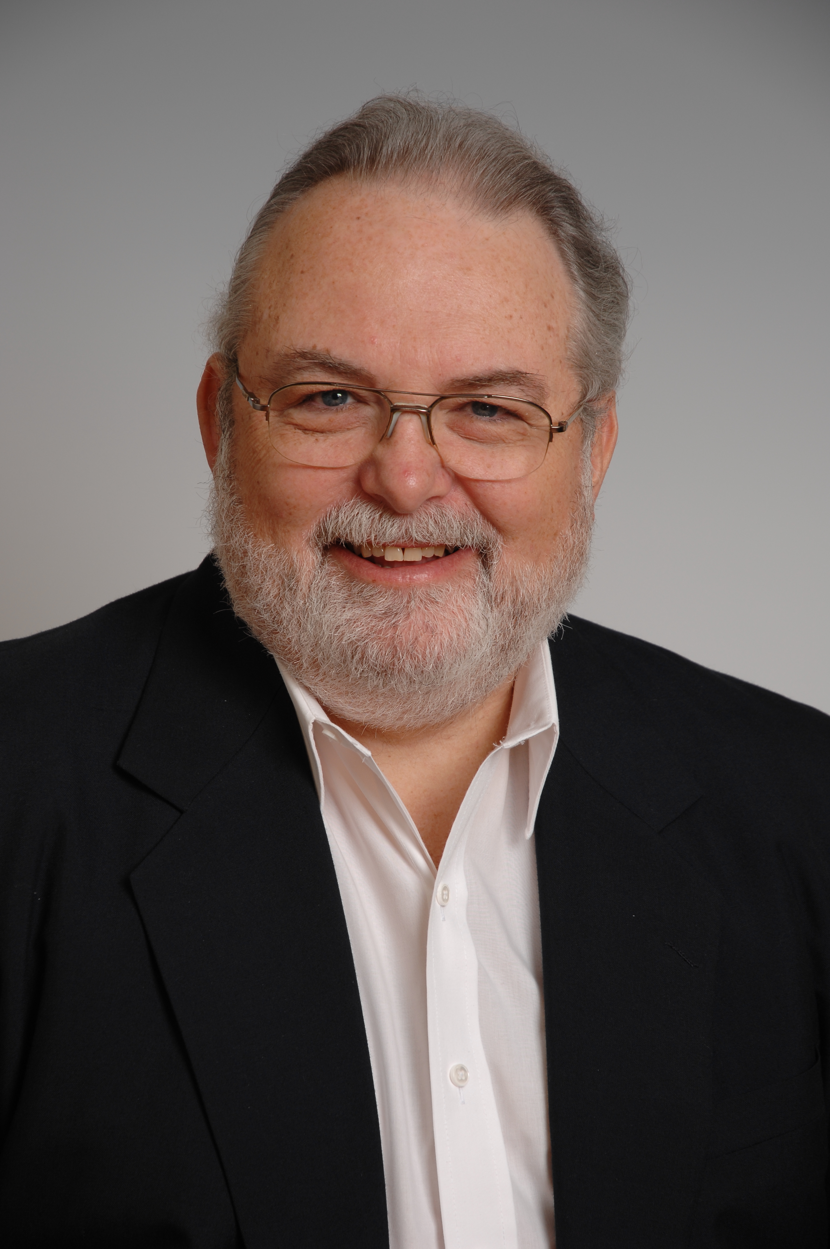 A headshot of an older man