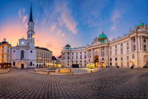 a stone-paved road by a palace