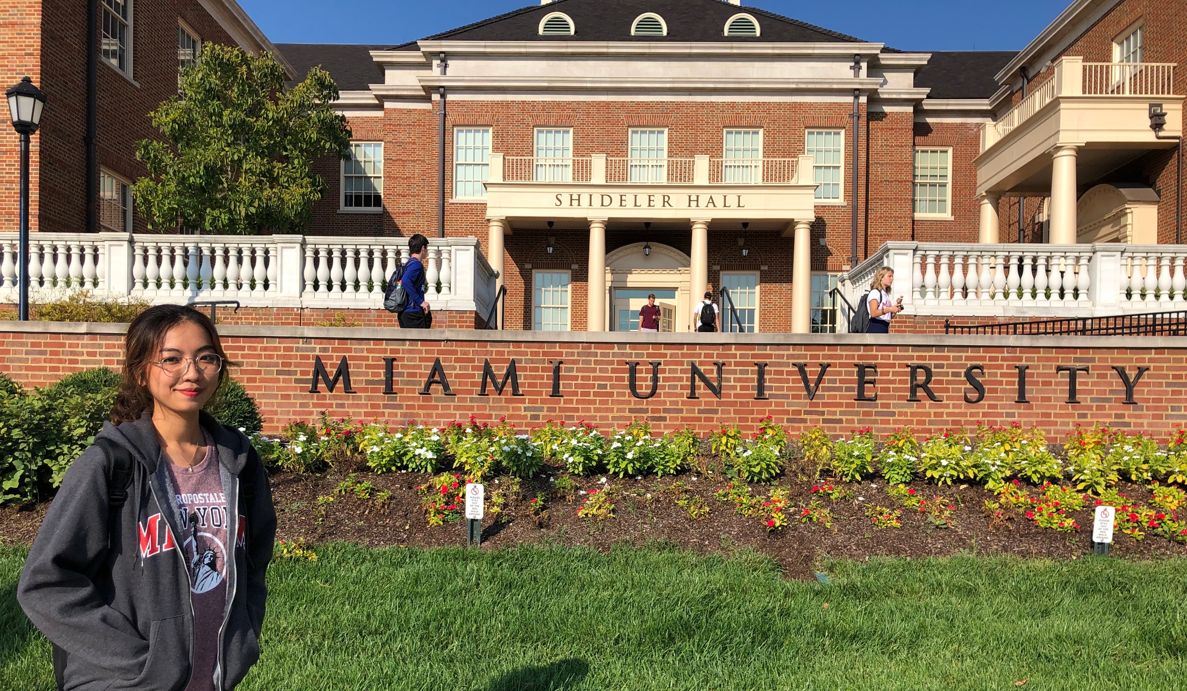 Megan poses in front of a Miami University sign