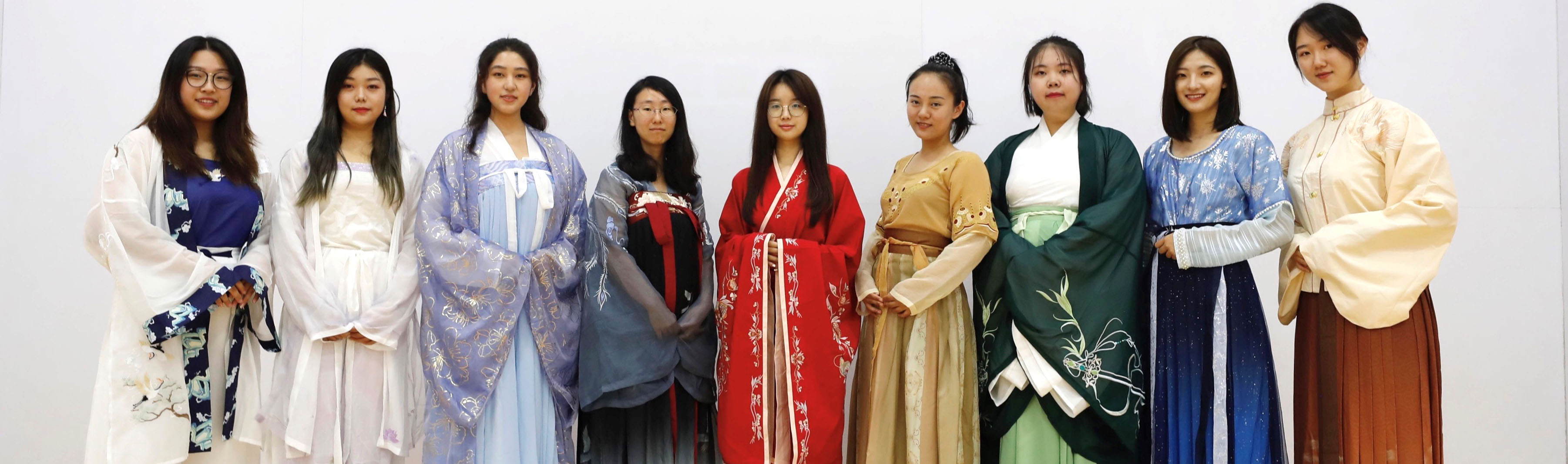 Bella and friends dress in traditional Chinese gowns