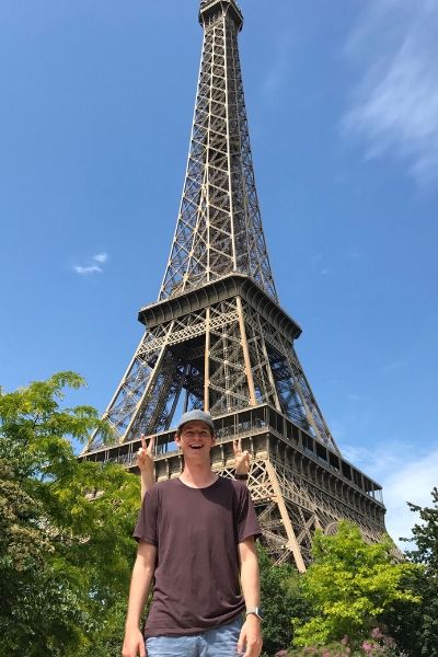 Eric Terry stands in front of the Eiffel Tower
