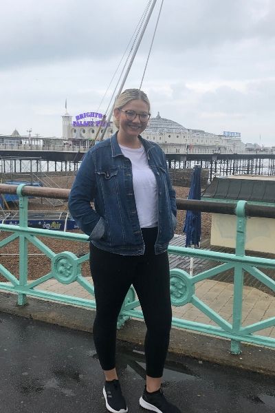 Halie Barger stands on Brighton Pier