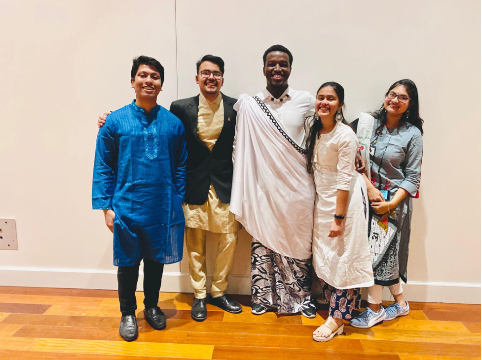 Aayush with a group of international students in beautiful clothing