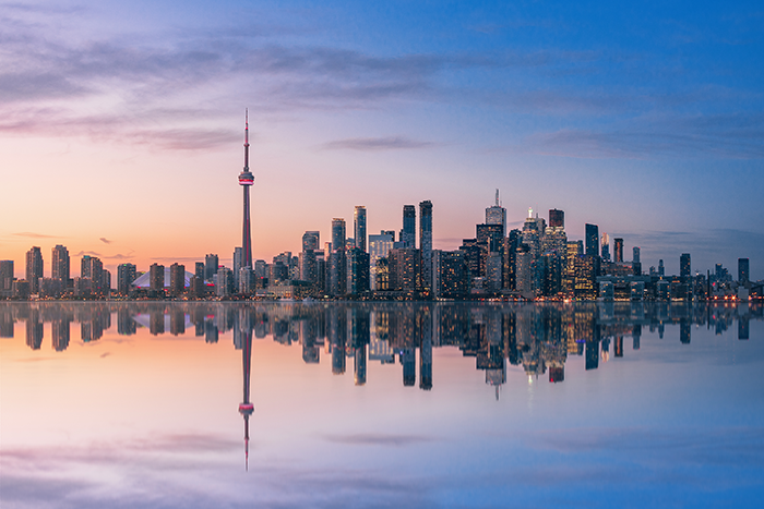 Toronto skyline reflected on water at night