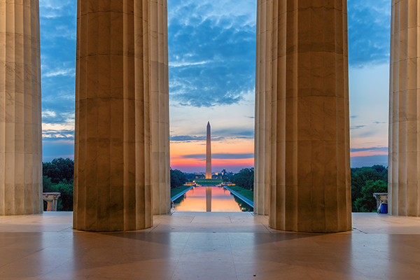Sunset view from Lincoln Memorial columns looking out at reflecting pool