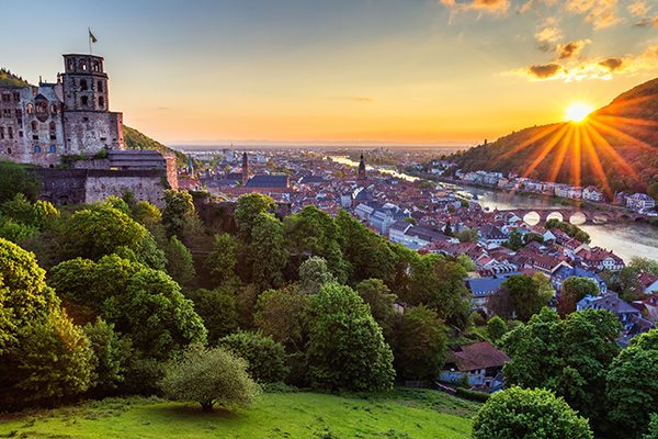 Sunset view of Heidelberg with river and buildings visible