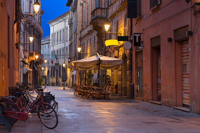 Bicycles, outdoor seating, and street in Italy