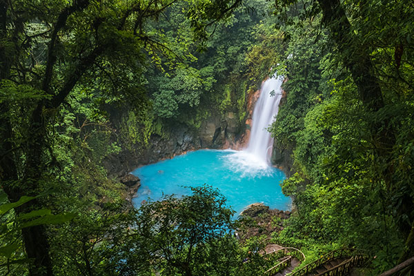 A waterfall in green jungle landscape of Costa Rica