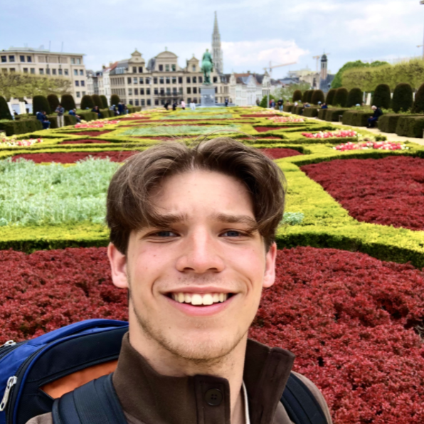 Michael Whidden with gardens in background during study abroad in Europe