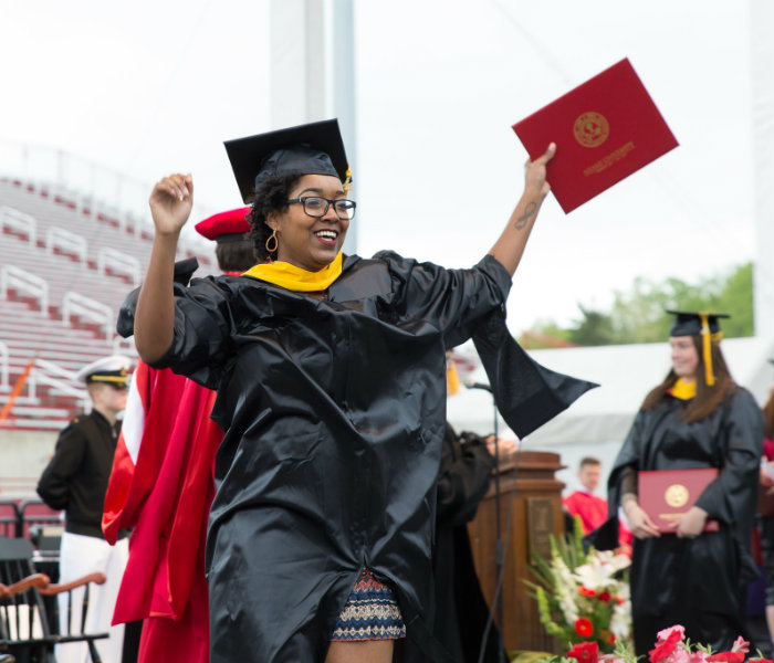  A Master's student celebrating after being given their diploma
