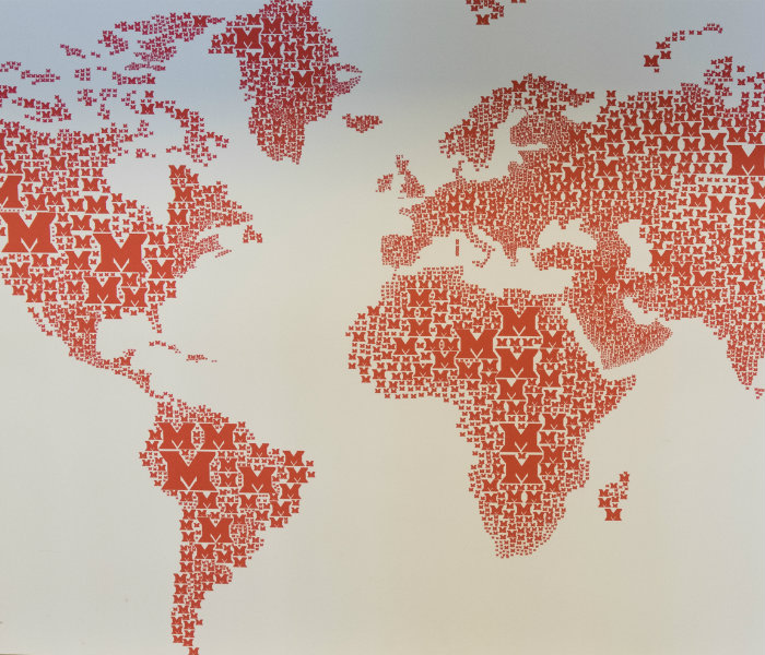 Flat map of the world with M's from where international students are from
