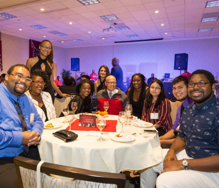  Students sitting with President Crawford during the 2017 jazz reception