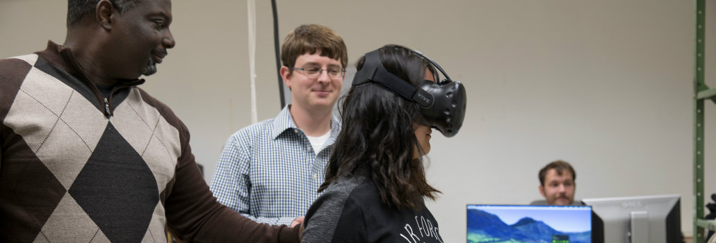  Student wearing a virtual reality simulator conducting an experiment