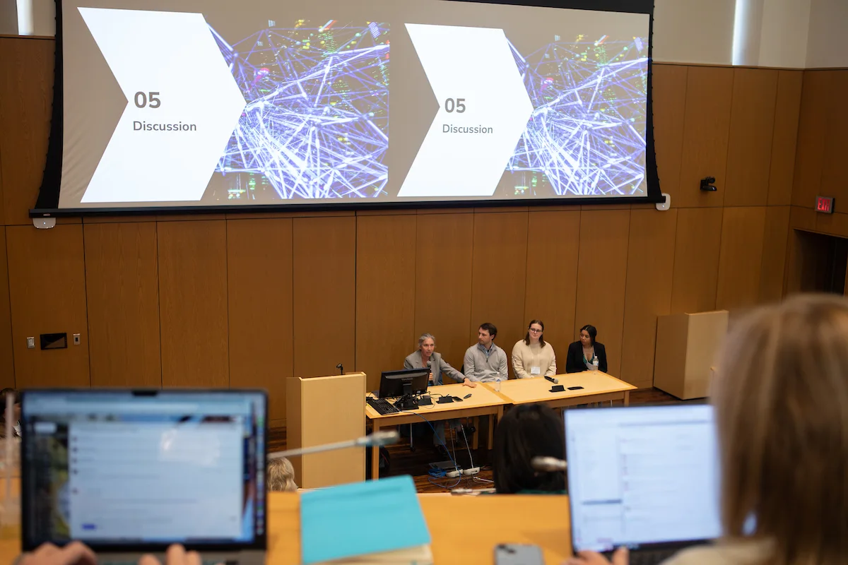 Faculty and students presenting information at the AI Symposium in the Armstrong Student Center in 2023