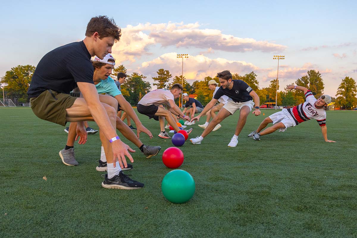 Club sports participants play a game on the field.