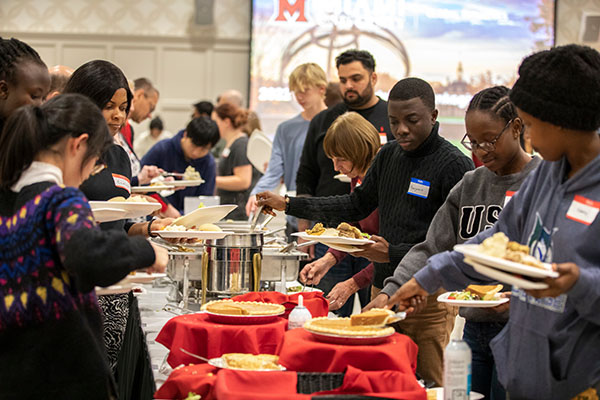 International and other students at a Thanksgiving buffet line at Shriver Center