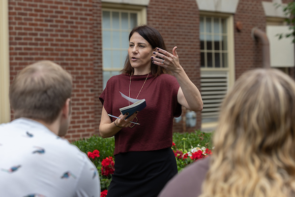 Michele Navakas teaching a class outdoors