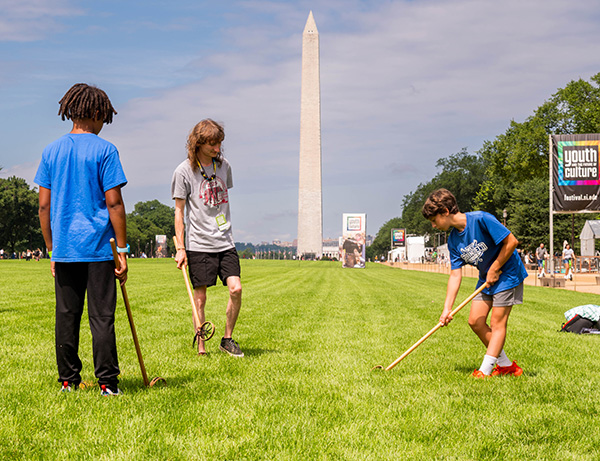 teaching myaamia lacrosse to youth on the National Mall
