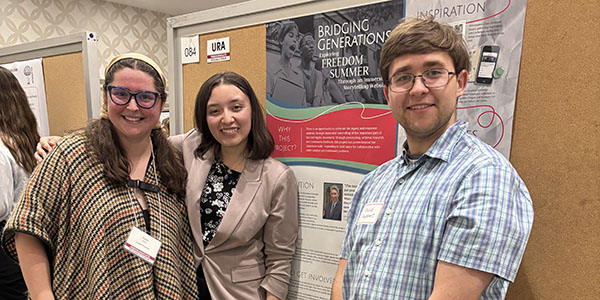Kylee Halter, Jojo Peregrina, and David Shuppert stand with their poster during the 2025 Undergraduate Research Forum