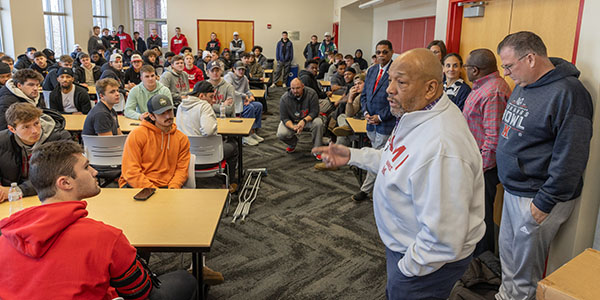 Rodney Coates talks with the Miami University football team
