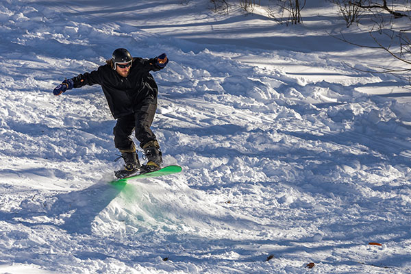 A snowboarder on Miami University's campus