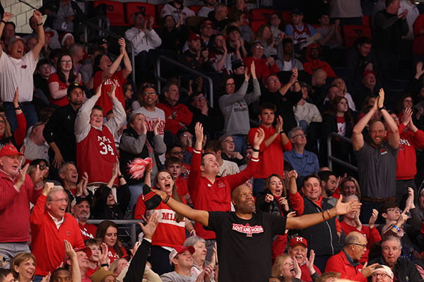 Ron Harper, center, leads the crowd at UD Arena