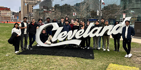 Into the LAND participants pose for a group picture out front of Rocket Arena