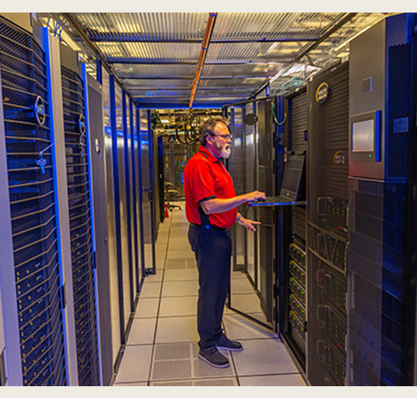 Andy Farler at a keyboard in the talon cluster containment area
