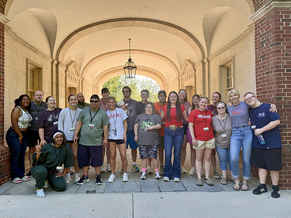 Participants of the Access Miami Program summer experience gather at Upham Arch with Miami University students who served as peer mentors as well as Ashley Cartell Johnson, clinical professor of Educational Psychology and coordinator of the Inclusive Education program (submitted photo).