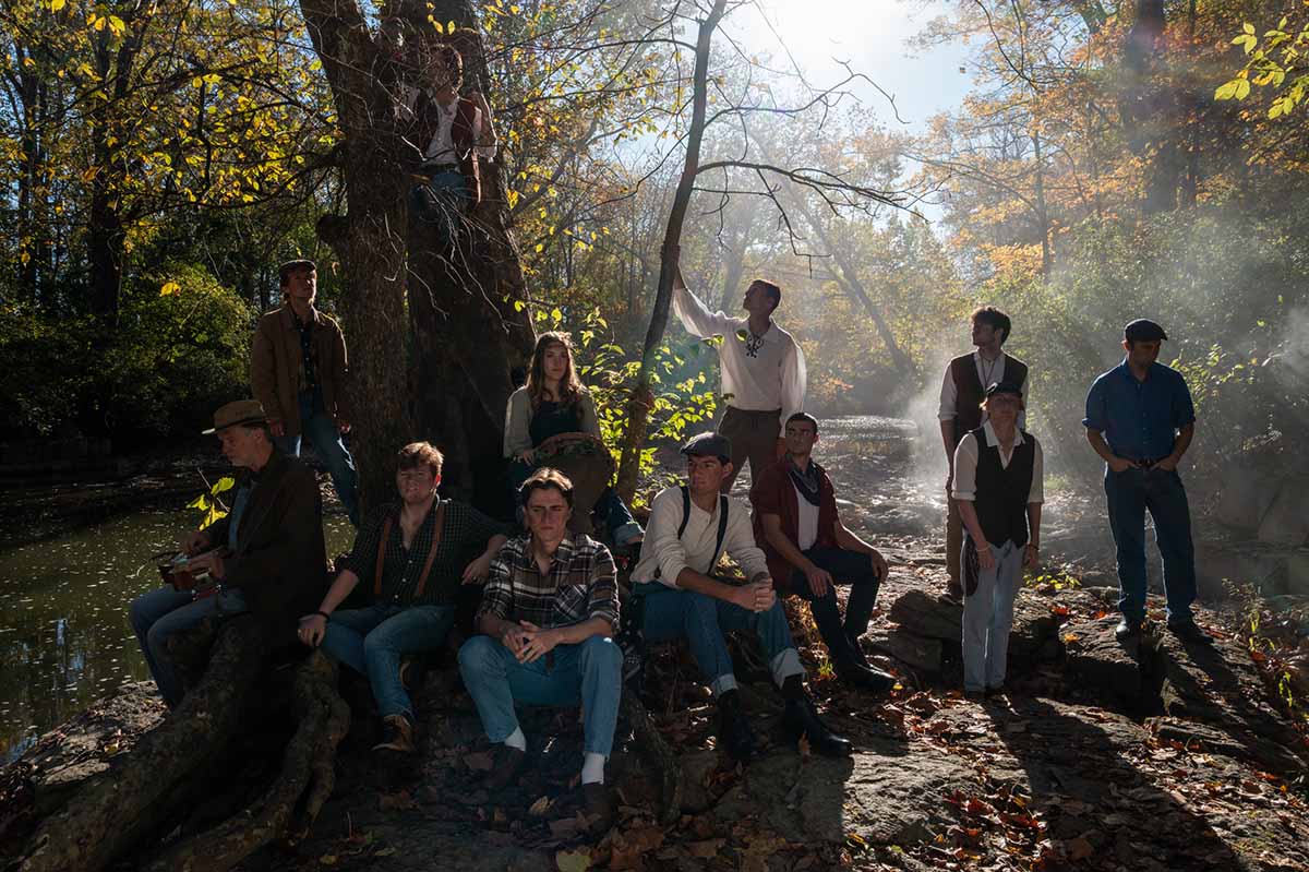 Glee Club members pose by a large sycamore tree next to Four Mile Creek. The tree, as well as the creek, have a featured role in the video 