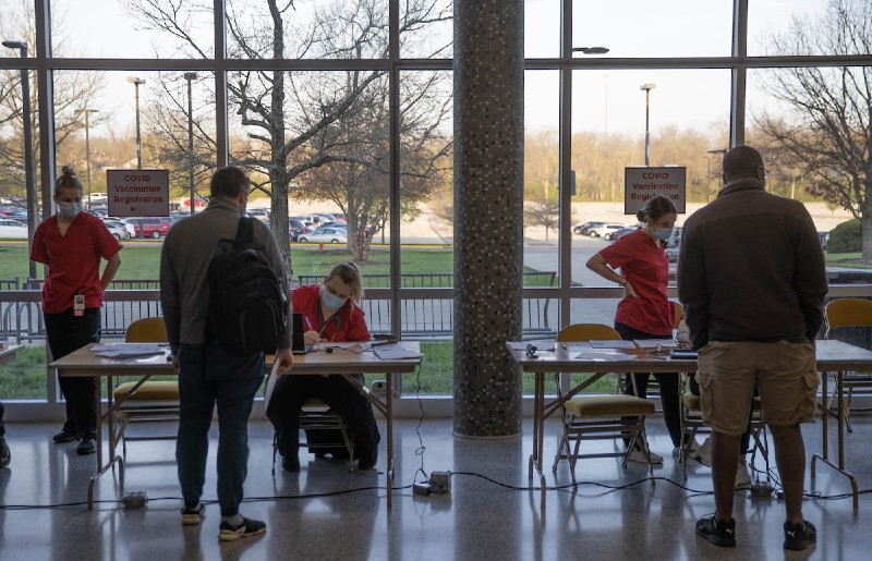 Students and staff getting signed in at the registration tables