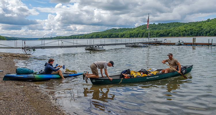  The guys landing their canoe and kayak on shore