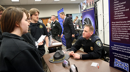 students looking at booths at a career expo