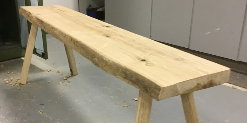 A single bench that was made during the woodworking class. 