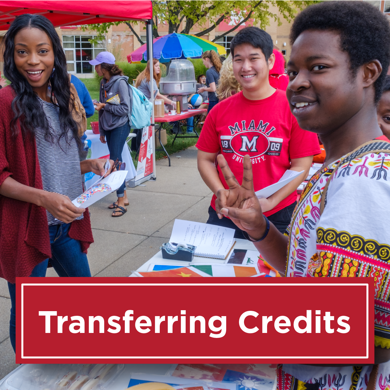 Image of three students during an annual fall fest event. Text reads Transferring Credit