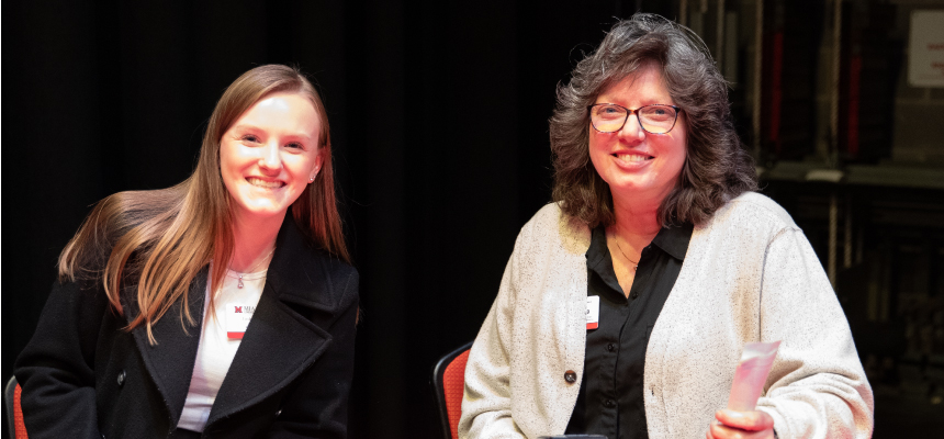 Tonya Moryl with a student working during an alumni event.