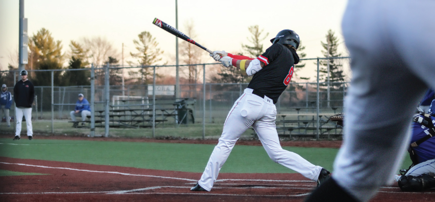 Hamilton baseball player in the batters box swinging at a pitch. 