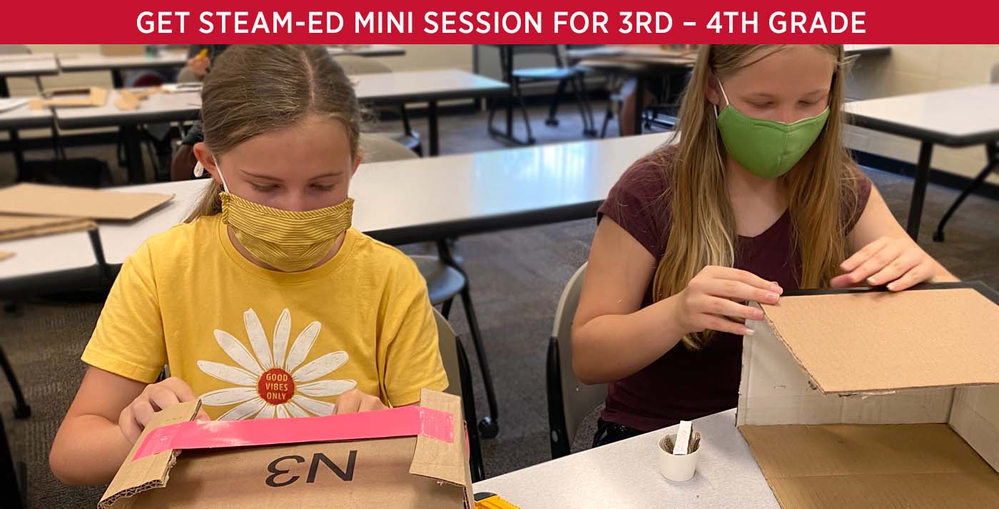 Two students working on STEAM projects