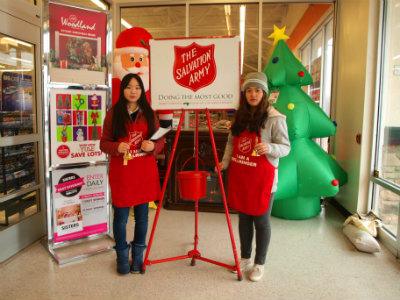Two international students working for the Salvation Army