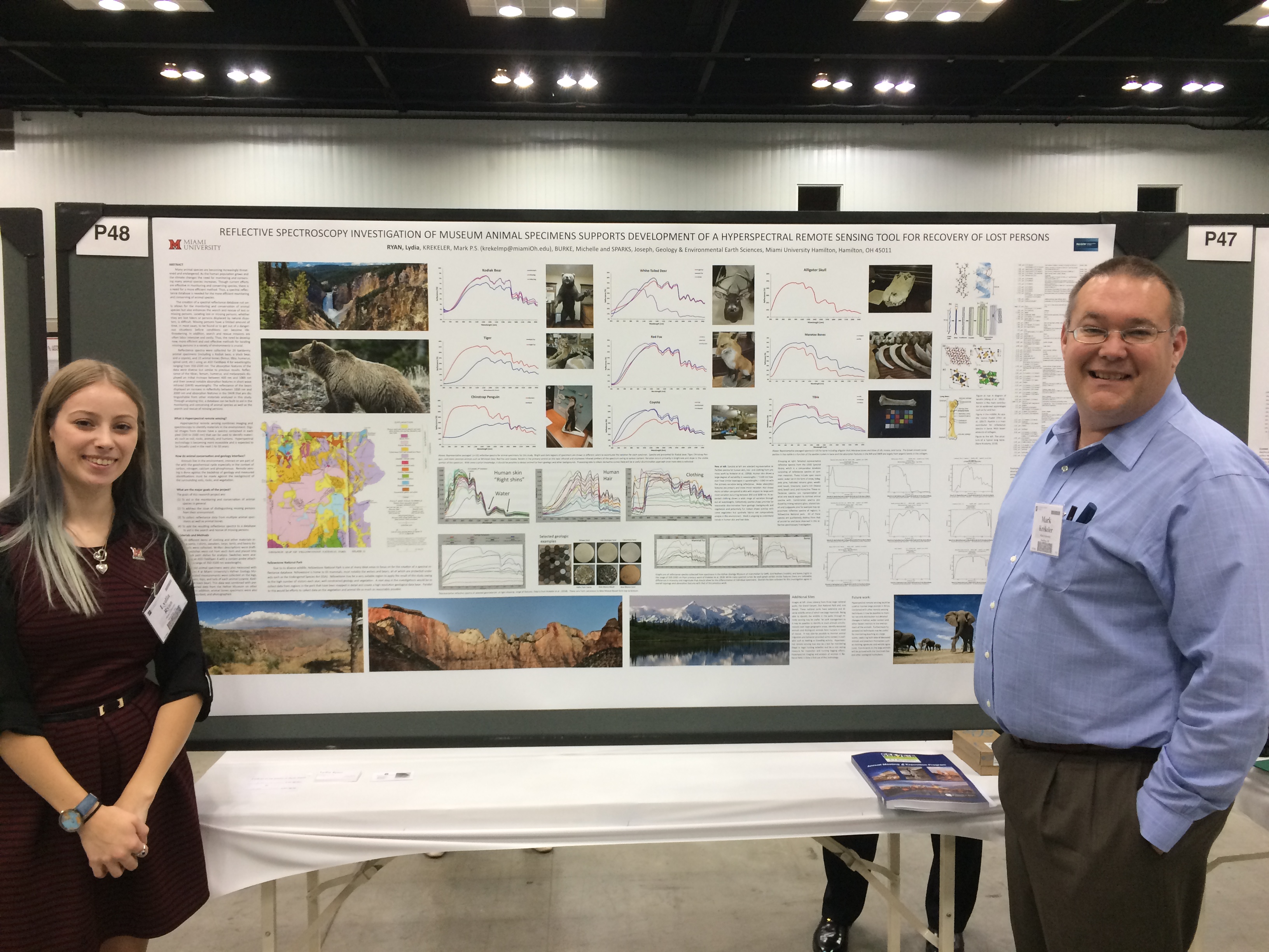 Photo of Lydia Ryan with Mark Krekeler as she presents her poster on reflective spectroscopy of animal specimens to support conservation efforts and support search and rescue technology.