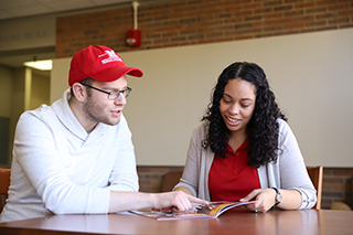 An admission counselor talking with a student