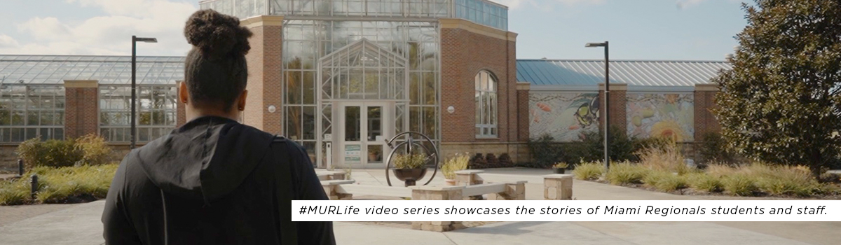 Ambresha Hancock walking outside of Mosler Hall towards the Conservatory. #MURLife video series that showcase the stories of Miami Regionals students and staff. 